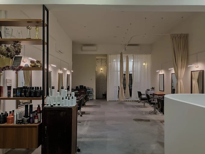 Updated GIP Nilai interior with timber shelves, styling mirrors and a white reception counter